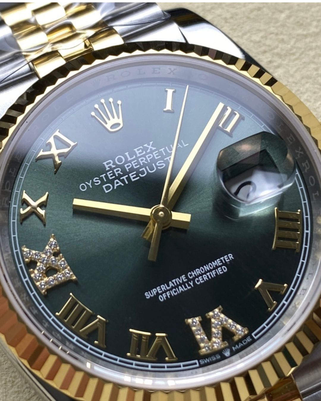 Rolex Date-Just 36mm two-tone watch with green sunray dial and diamond hour markers