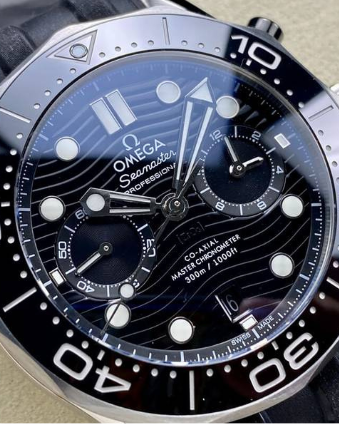 Omega Seamaster 44mm Diver 300m watch with black ceramic bezel and blue wave-pattern dial