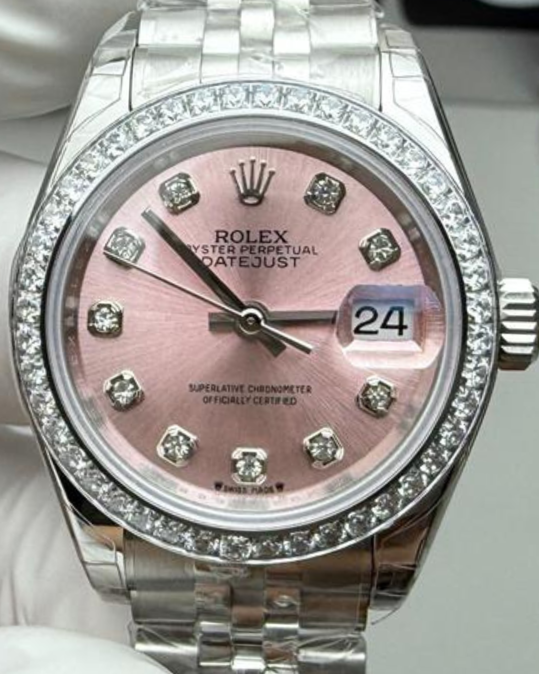 Datejust Super Watch with mother of pearl dial, diamond bezel, stainless steel bracelet, and date display