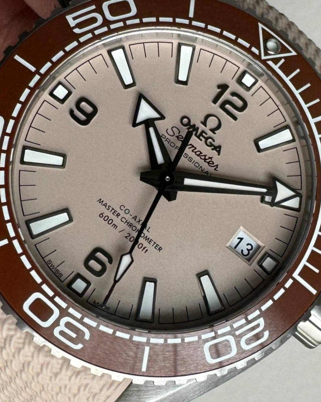 Planet Ocean 600 beige dial watch with A8900 movement and brown bezel