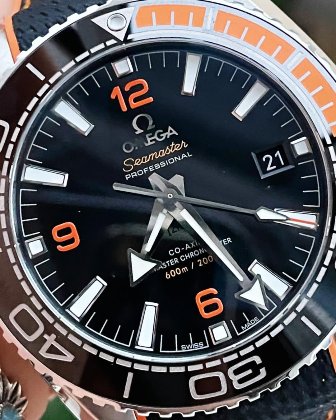 VSF Planet Ocean Super Watch with black dial, orange accents, and durable design