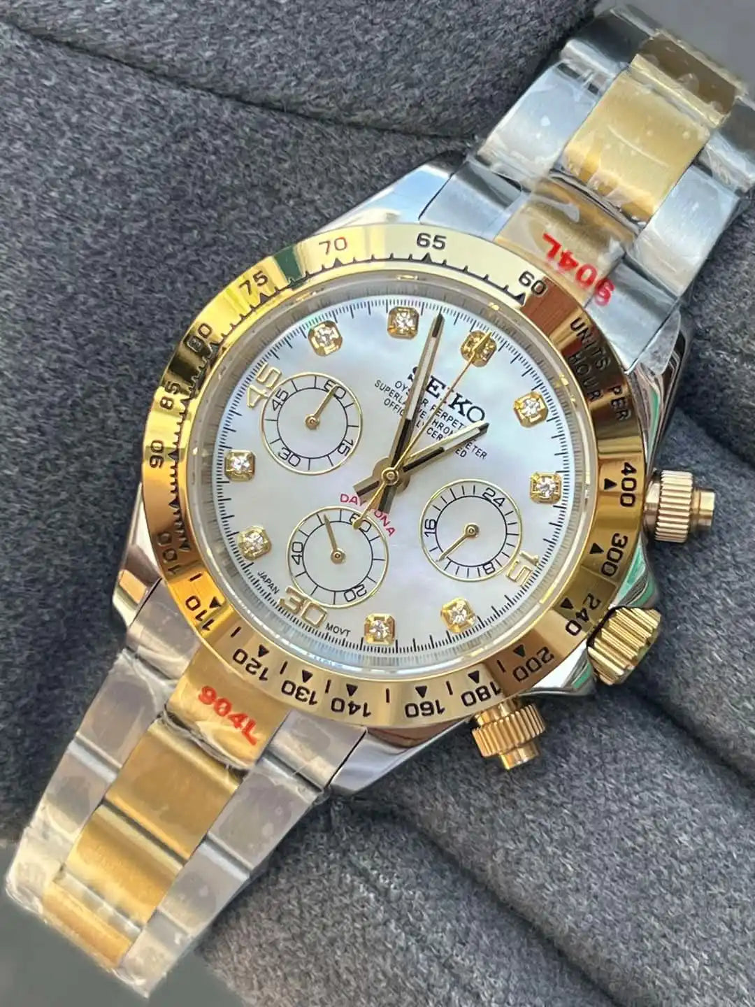 Two-tone Seiko wristwatch with diamond hour markers.