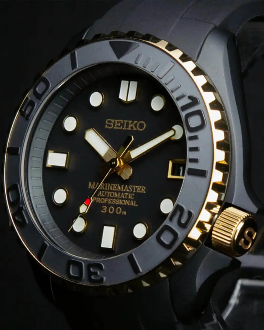 A black and gold Seiko dive watch with a rotating bezel, luminous markers, and a date window.