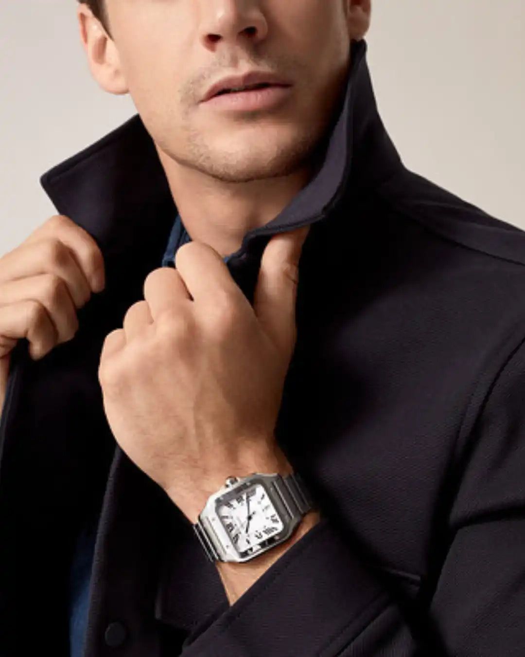 Men’s stainless steel watch with a white dial and black Roman numerals.