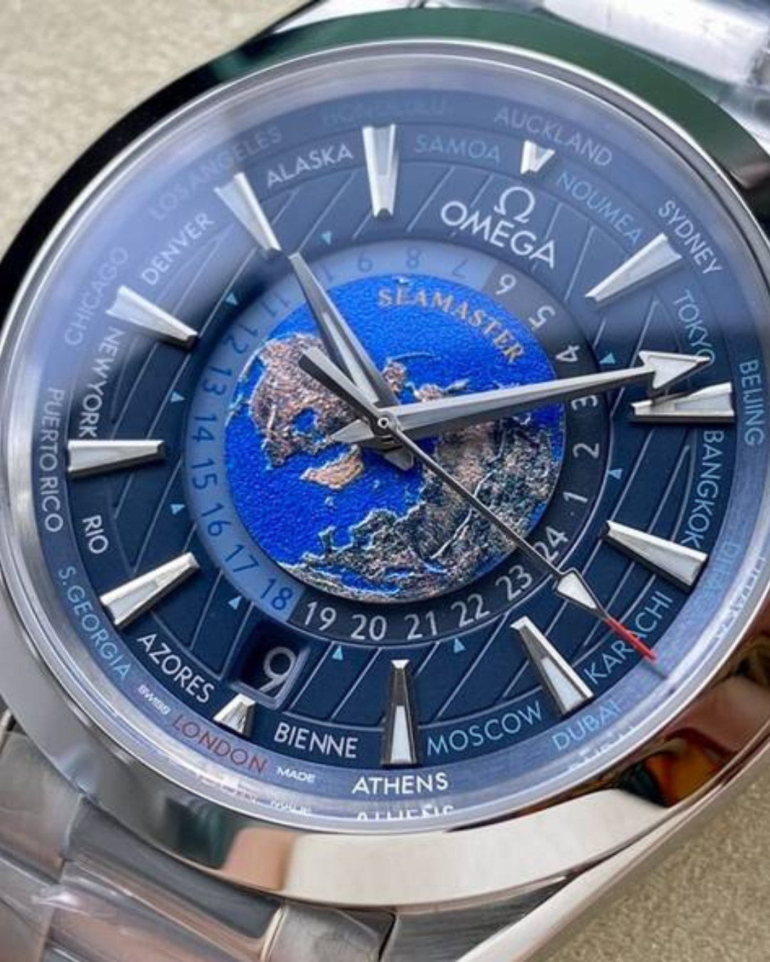 Omega Aqua Terra Word Timer watch with blue dial and world time feature