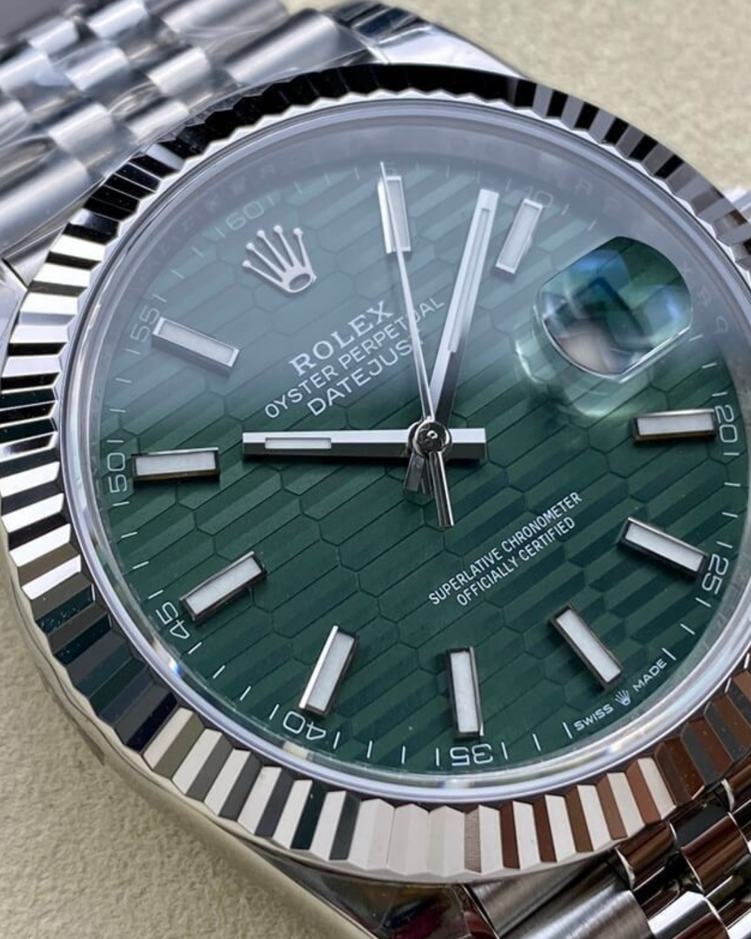 Rolex Date-Just 36mm watch with green textured dial and fluted bezel on Jubilee bracelet