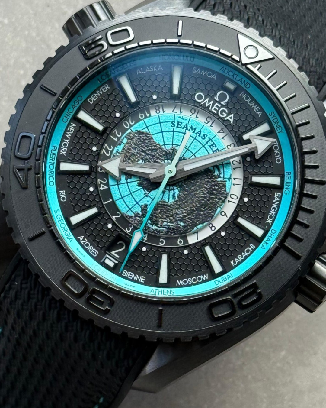 Omega Planet Ocean 45.5mm GMT World Timer watch with blue dial and black bezel