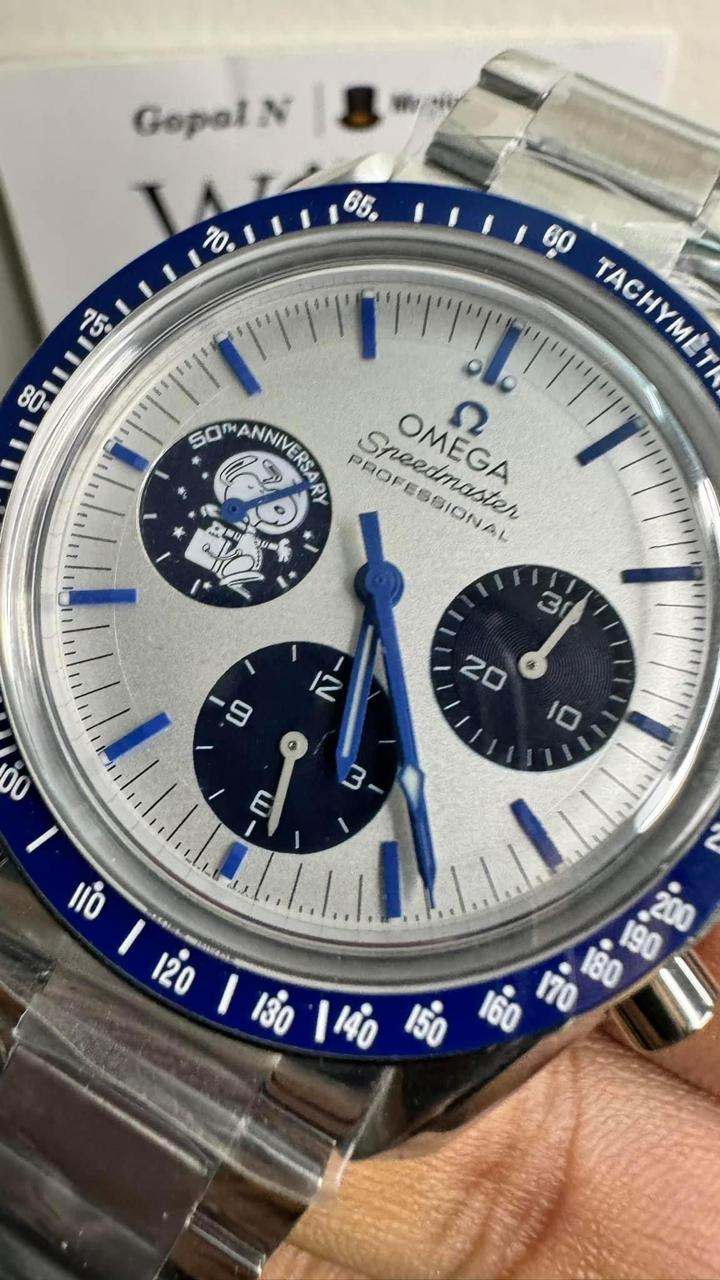 Omega Speedmaster Professional Super Mod Watch Silver Snoopy Award 50th Anniversary with blue ceramic bezel and white dial with blue chronograph subdials